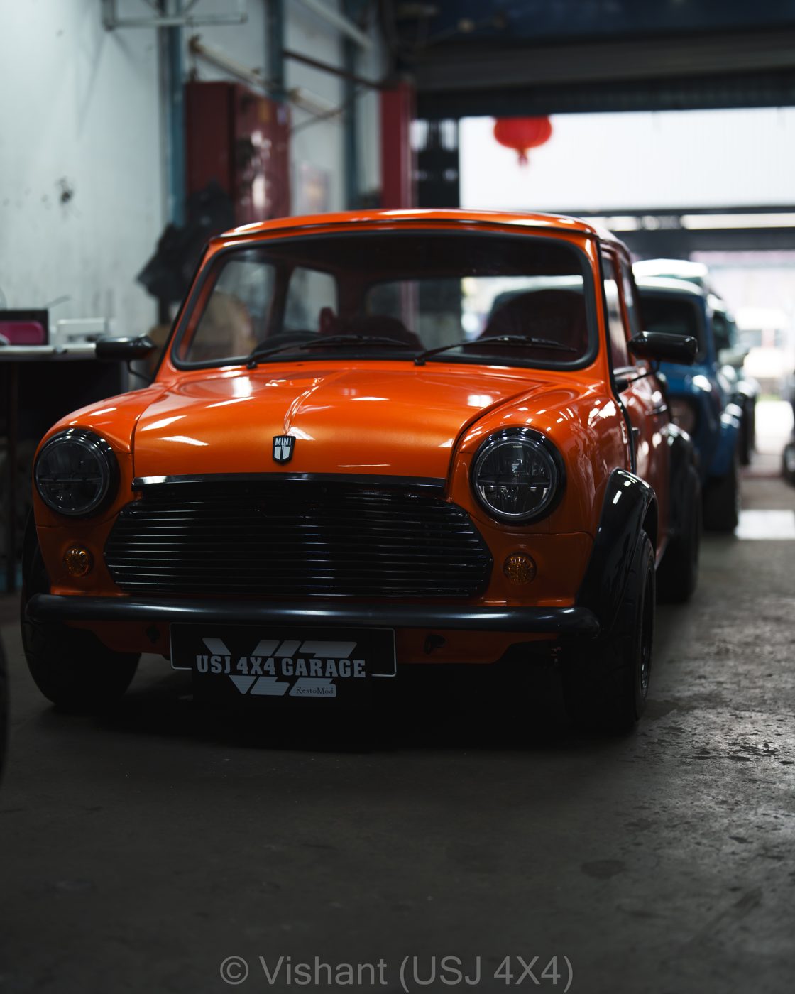 Orange supercharged classic Mini, front