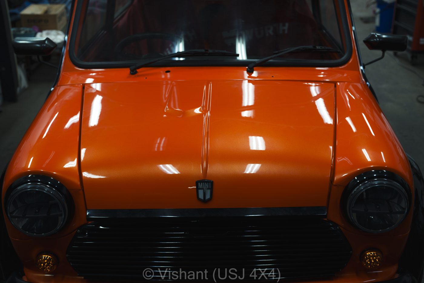 Orange classic Mini, rear