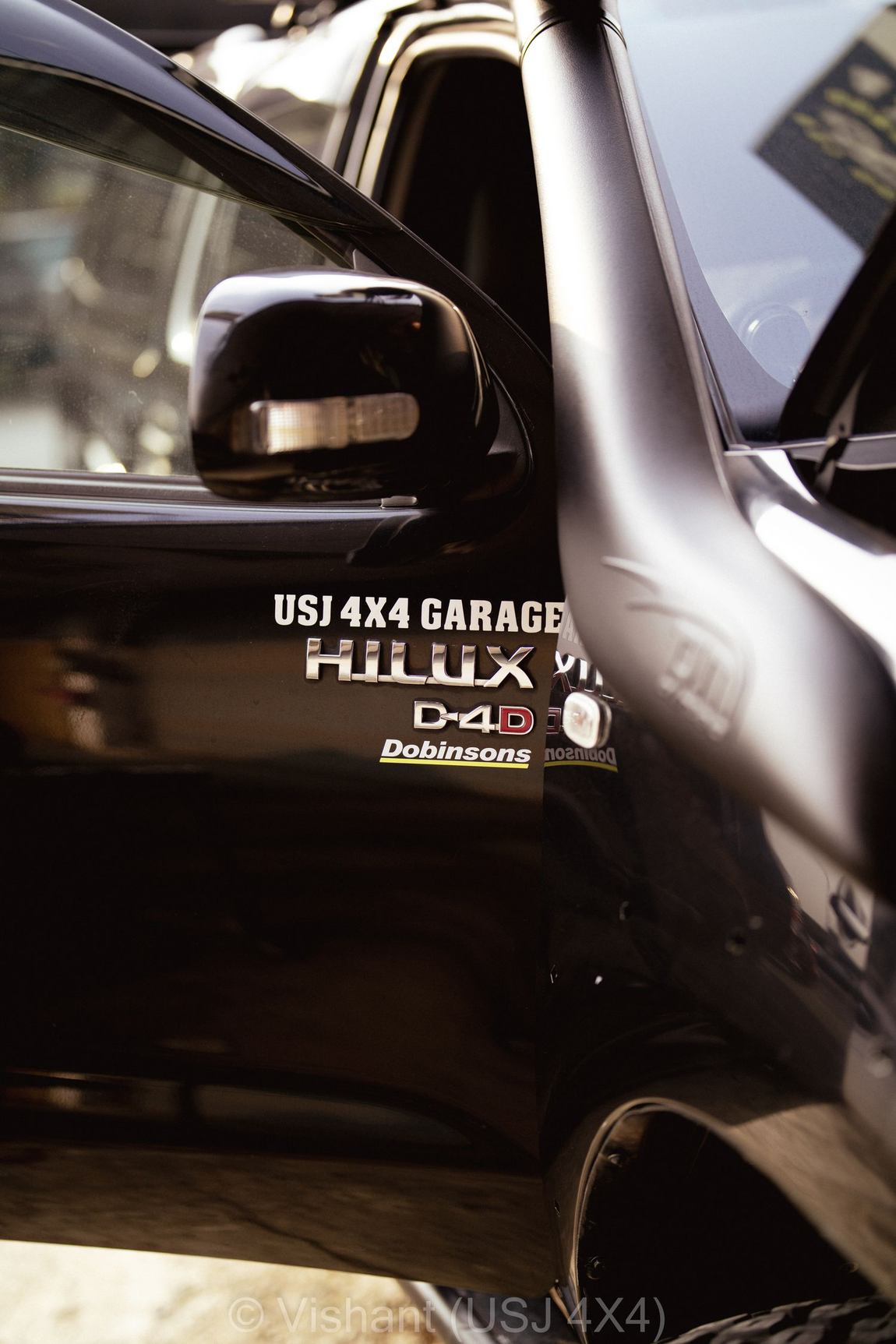 Hilux D-4D and Dobinsons decals on the rear tub